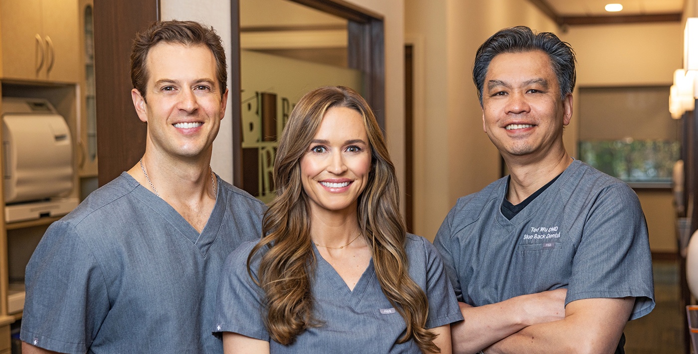 Three smiling dentists at Blue Back Dental