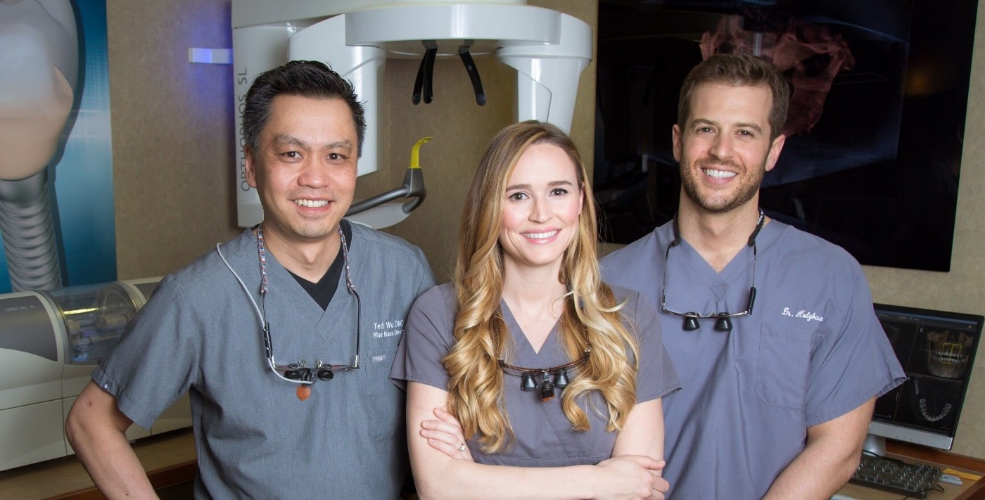 Three smiling emergency dentists in West Hartford and Avon