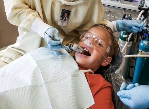 Child smiling during their dental exam