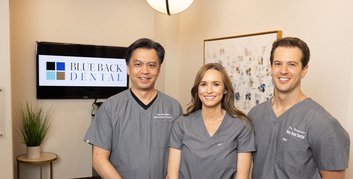 Three smiling dentists at Blue Back Dental