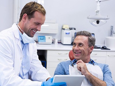 Dentist and patient reviewing a dental X-ray