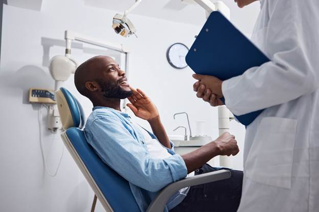 Patient talking to a dentist