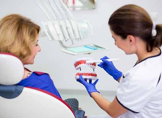 Patient in West Hartford talking with dentist about dentures